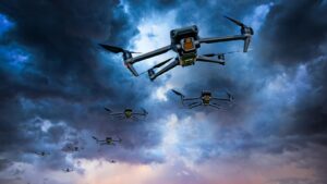 A sleek Ukrainian drone with spinning rotors flies in the sky, captured during twilight with a cloudy, stormy horizon in the background.