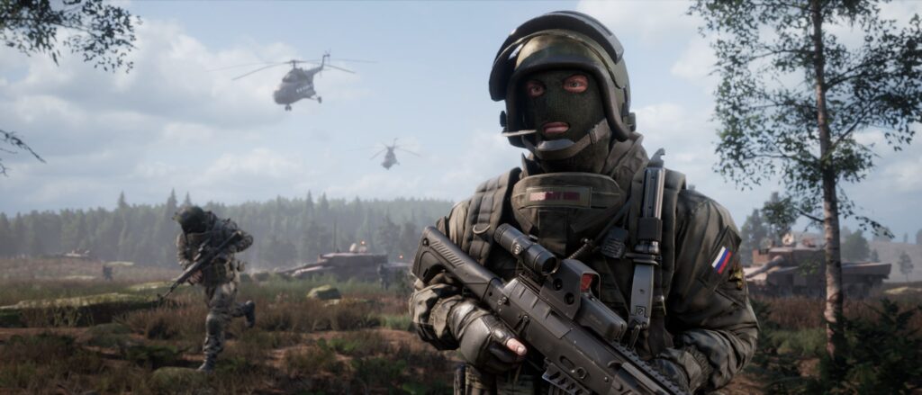 A close-up of a masked soldier holding a rifle, with a Russian flag patch on the uniform, standing in a forested battlefield. In the background, another soldier runs, helicopters hover, and a tank is visible under a cloudy sky.